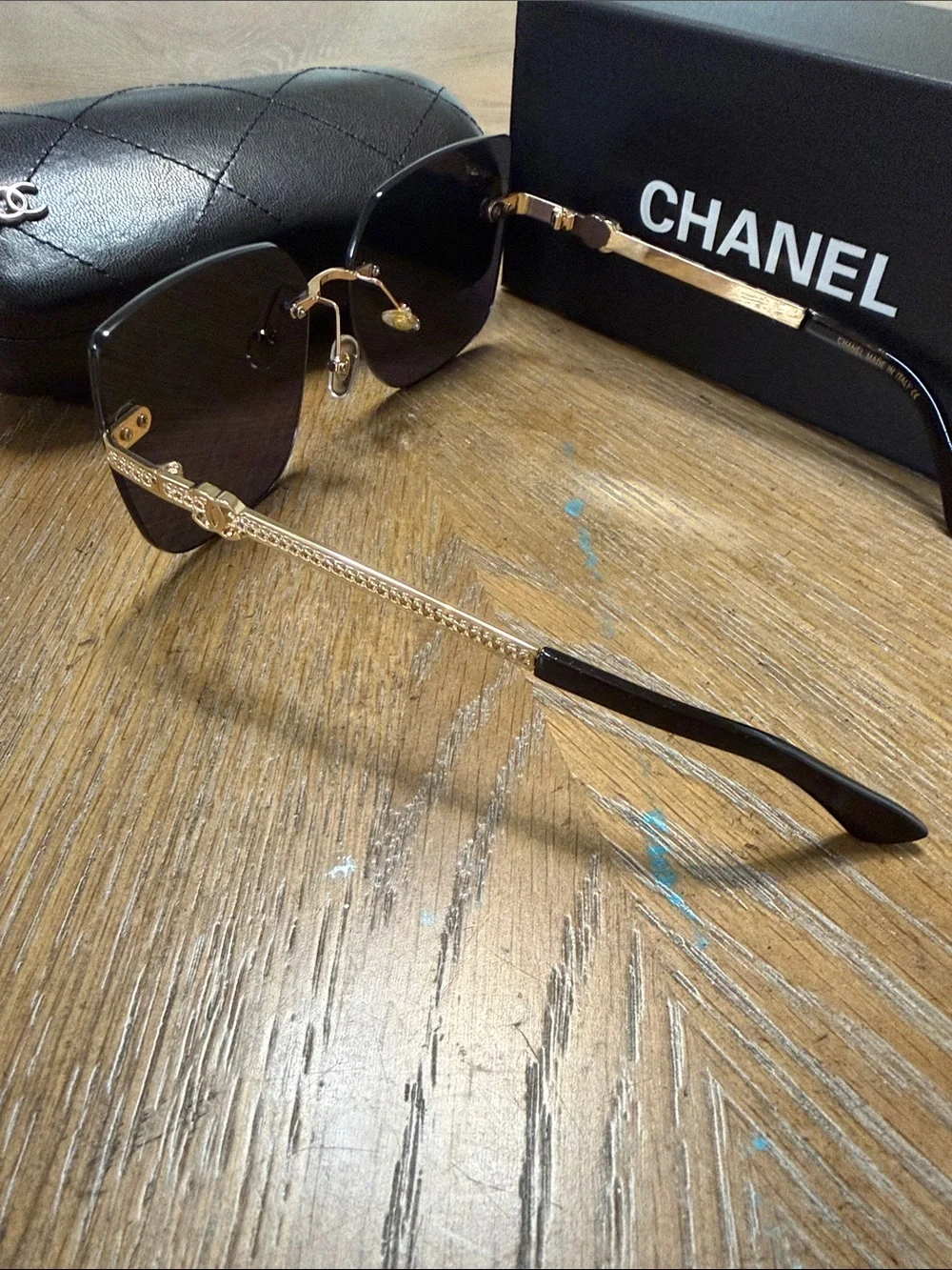 CHANEL Rimless Square Sunglasses in Dark Gradient with Gold Accents